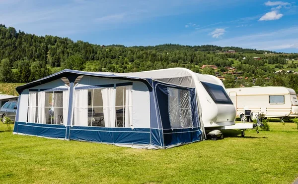 depositphotos_111696660-stock-photo-modern-caravan-at-camping-site